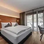 Отель Alpenparks & Taxacher Кирхберг